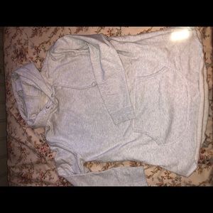 Light gray Kith hoodie. Zipper side detail